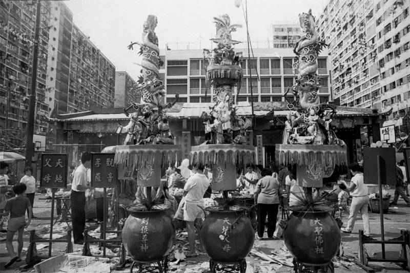 Three giant incense sticks with sophisticated decoration are burning during the Monkey God Festival.
