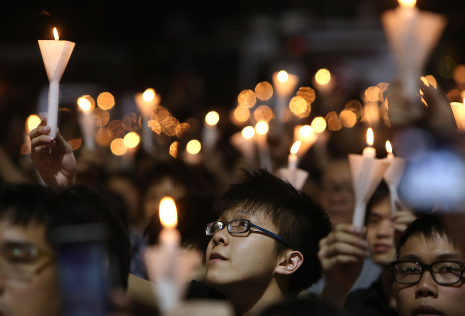 Tens of thousands of people take part in a candlelight vigil at Victoria Park to mark the 23rd anniversary of the military crackdown of the pro-democracy movement at Beijing's Tiananmen Square in 1989
